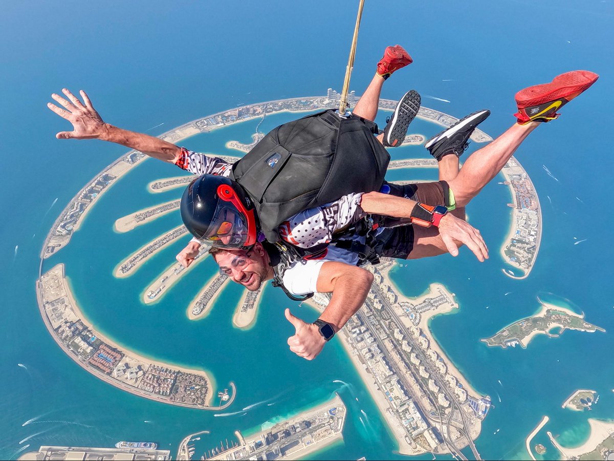 Tandem skydivers above Palm Jumeirah in Dubai